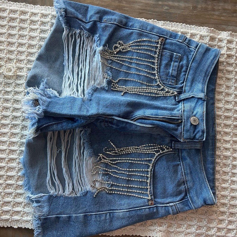 Chic Blue Distressed Denim Shorts with Chain Accents